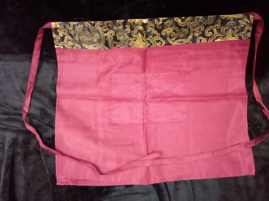 RED APRON WITH BLACK AND GOLD TRIM