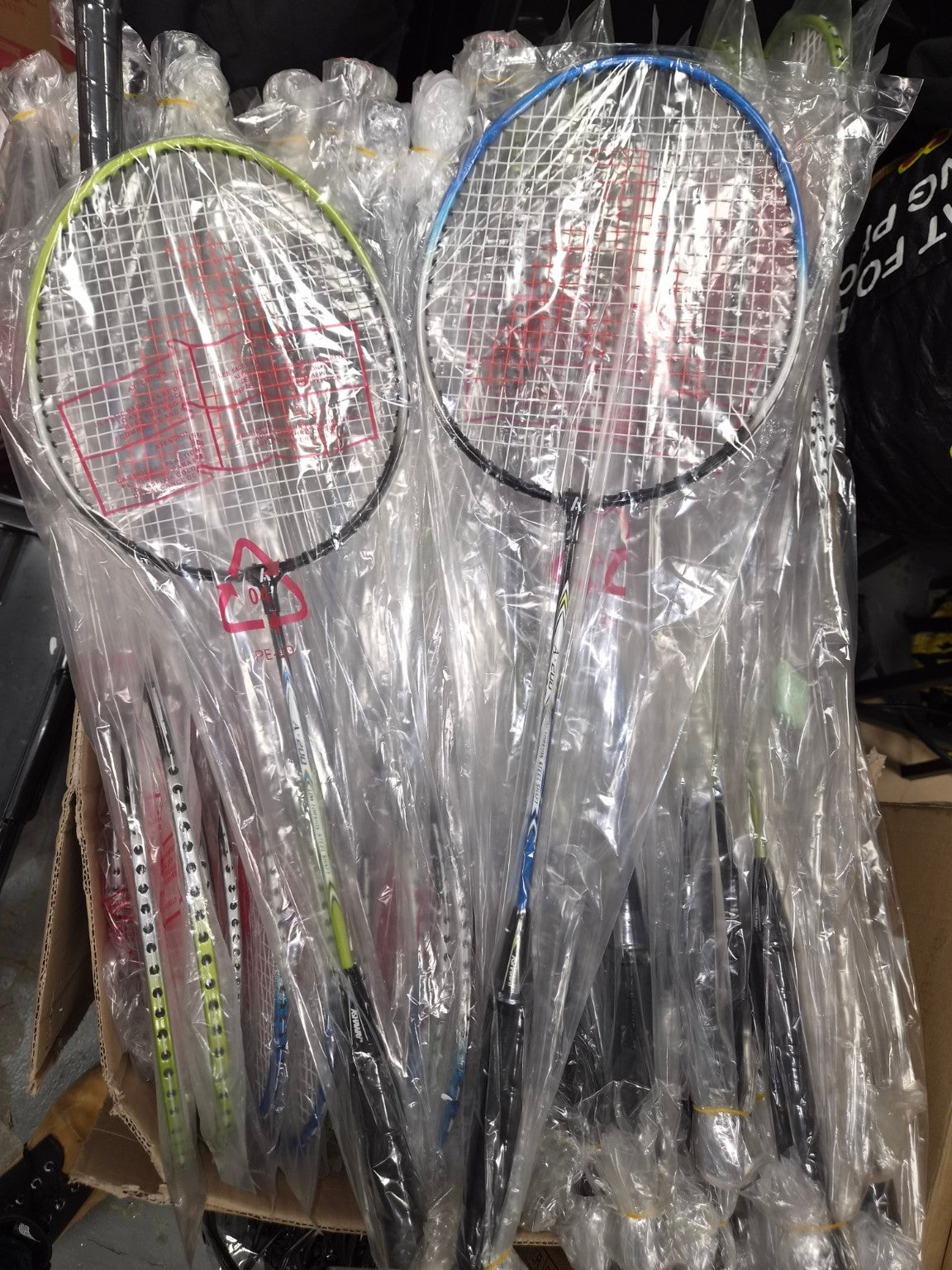 Blue and green Ashaway A-200 badminton rackets, factory wrapped